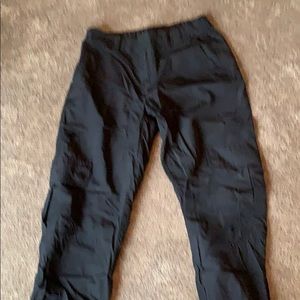 Black parachute pants.